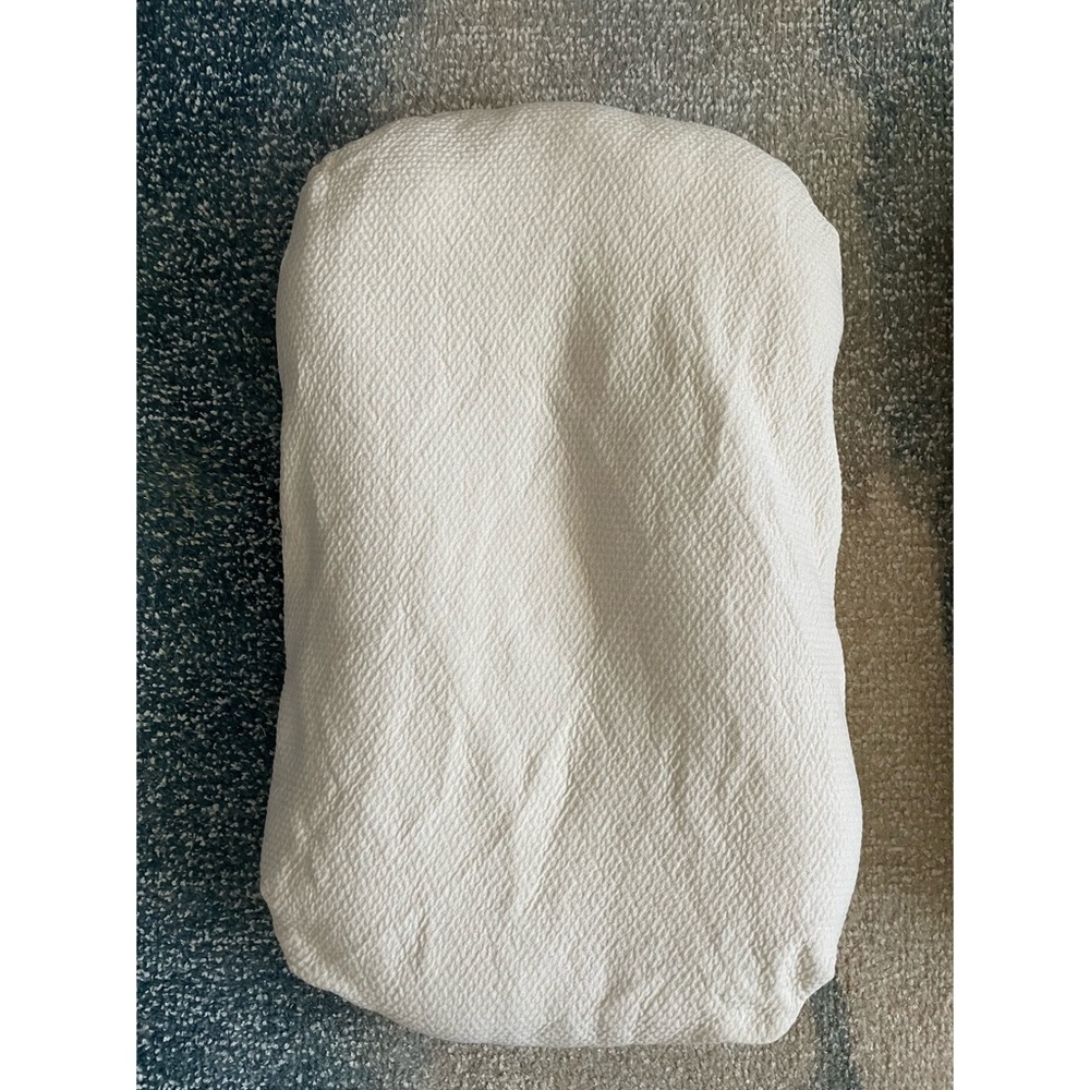 The Snuggle Me® Puddle Pad is a fitted pad